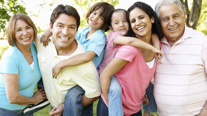 A multi-generational latin family having fun outdoors