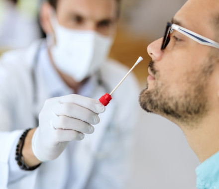 Close-up of young man getting PCR test at doctor's office during coronavirus epidemic. (56 kB)