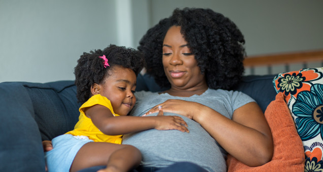 pregnant mother and young girl