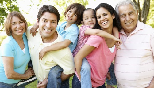 A multi-generational latin family having fun outdoors