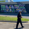 OIDP’s LT. Erica Bussey Jones and CAPT John Oguntomilade at a mural commemorating Black Wall Street in Tulsa, Oklahoma